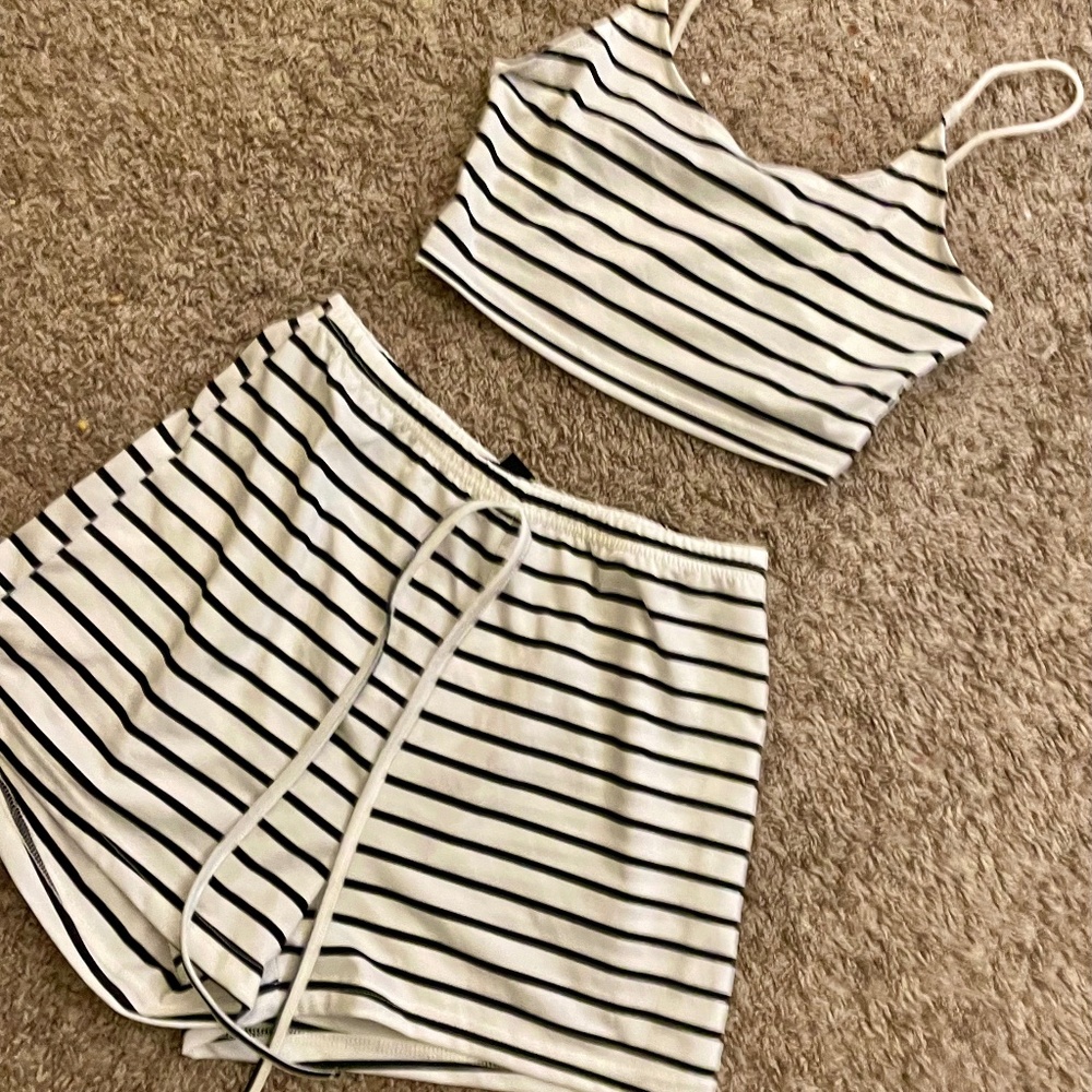 white and black striped matching outfit of shorts and cropped tank